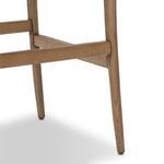 Close-up detail of wooden frame leg and crossbar junction with light wood grain