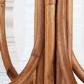 Detail of thick natural brown rattan rods intertwined at chandelier’s center