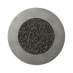Top-down view of circular fire table focusing on dark, textured lava stones in center