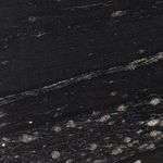 Close-up of Jasper Nightstand black marble shelf surface showing dark veining and texture