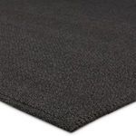 Close-up of Ryker rug edge showing woven polypropylene and polyester texture