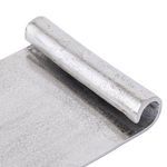 Close-up of raw nickel finish with textured brushed aluminium and rolled tray edge