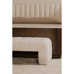 Verity bench styled at foot of a wooden bed with neutral bedding and carpeted floor