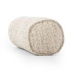 Close-up of the pillow’s rounded end showing boucle texture and stitching