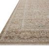 Close-up angled view showing the Ida Bark / Multi rug’s detailed border and muted floral pattern