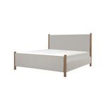 Angled view of Warren Bed showing depth of beige fabric upholstery and wood post framing