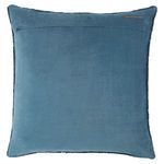 Back of pillow showing solid fabric with sewn label near top edge and zippered closure