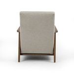 Rear view showcasing solid fabric backing and walnut wood frame of recliner