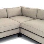 Close-up corner view illustrating cushion joint and structural frame under cushions