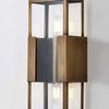 Close-up of Santa Clara sconce showing Patina Brass surface texture and exposed light bulbs