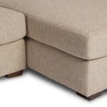 Close-up of seat and chaise cushions meeting seam and block wooden feet at base