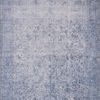 Loren Slate Rug with vintage-style faded blue floral and intricate border patterns on a soft polyester base