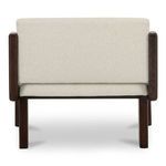Back view showing snug cushioned back panel with simple seam lines and square wooden legs
