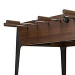 Side view showing brown wooden handles and smooth wood grain finish on foosball table