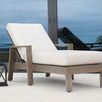 Laguna Chaise Lounge in white cushion set on outdoor patio with ocean view and black lantern