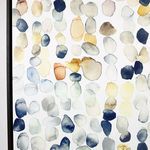 Partial side view of framed artwork emphasizing black frame and clustered raindrop shapes