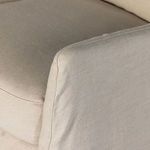 Zoomed detail on armrest seam and cushion edge showing fabric finish and stitching