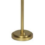 Close-up of round natural brass lamp base with small cylindrical switch