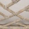 Close-up detail of rope wrapped intersections within the geometric wooden back lattice