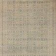 Rectangular blue and natural rug featuring intricate geometric and tribal patterns in soft muted tones