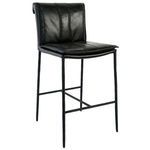 Mayer Stool with thin black iron legs and rolled black leather backrest featuring decorative stitching