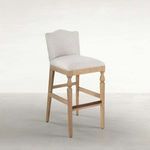 Gaston Upholstered Wooden Stool with slipaway sand fabric seat and curved back, rustic French Oak frame with classic turne...