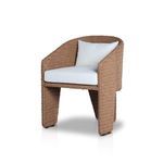 Close-up of rounded wicker frame wrapping around armrest and back cushion