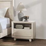 Close-up side angle of Reece Nightstand showing natural wood grain and light finish under soft lighting