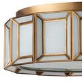 Flush mount ceiling light casting soft amber glow through white milk glass diffuser