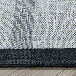 Close-up showing woven jute and cotton texture with black border detailing