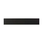Top-down view of flat black wood surface and drawer front edge detail