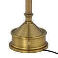 Brass charging base with attached black power cord extended