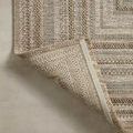 Rug edge folded to show backside and secure stitched binding for durability