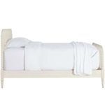 Jennifer Twin Bed side profile highlighting spindle headboard and footboard with white bedding