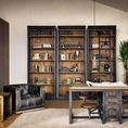 Three Ivy Bookcases arranged side by side in a rustic styled workspace with leather chair and industrial desk
