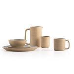 Four natural speckled plates stacked with focus on clean, smooth top surfaces and visible rim