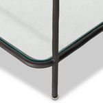 close-up detail of rounded corner and hammered texture on gunmetal frame with glass shelf