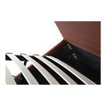 Close-up of slatted base angled upward by hydraulic lift inside rust fabric bed frame