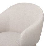 Close-up of the taupe fabric upholstery on the armrest and backrest corner