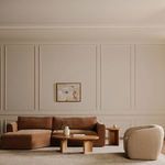 Gaia framed painting hanging above sofa in beige-toned modern living room