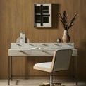 Close-up detail of camel upholstery fabric texture with wood frame edge and chrome swivel pole