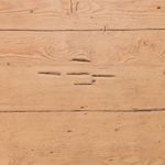Oblique left side showing table length with balanced leg angle and rustic pine finish