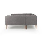 Straight-on rear view of banquette showcasing clean linen fabric and leg spacing