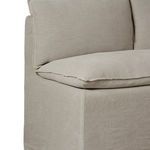 Detail of cushion corner and slipcover stitching with soft wrinkled linen fabric