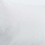 Close-up of white linen cashmere fabric texture on sham surface
