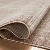 Folded section of rug showing backside weave and flexible polyester construction