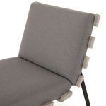 Detail of padded charcoal cushion on backrest showing smooth fabric surface