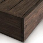 Close-up on a corner joint of the coffee table showing fine craftsmanship in teak