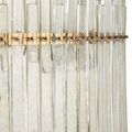 Close-up focused on upper tier vertical glass bars with visible hammered texture and gold metal ring