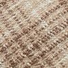 Close-up of the textured woven fabric with brown and ivory threads in the Beau pillow's check pattern
